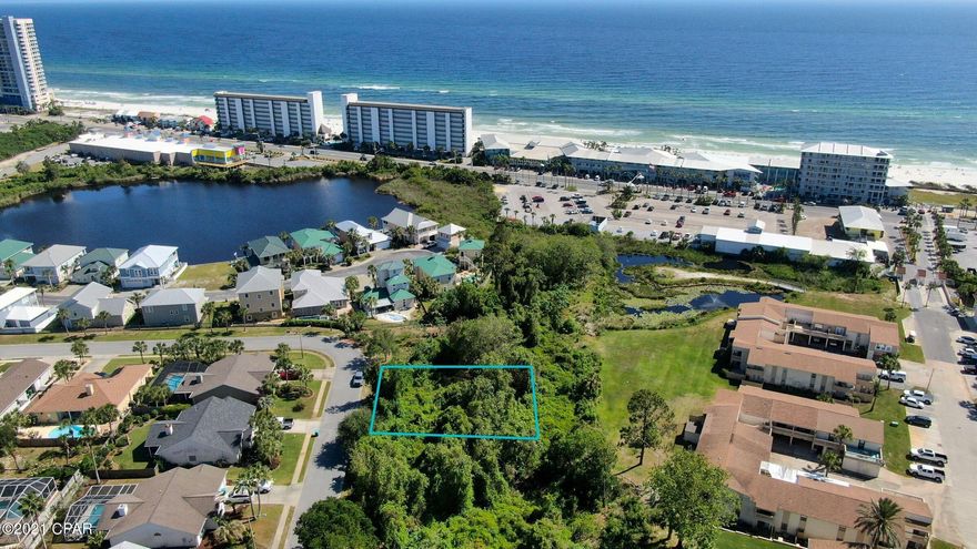 Imagine sitting on your balcony with a view of the gulf.  One of the only lots with GULF VIEW potential from this subdivision. One of the only lots left in highly sought after Summer Breeze community. Low HOA's. Permits in place with DEP through 3/4/26. Close to beach access 66 with underground utilities and just a short drive to the shopping, restaurants and entertainment of Pier Park. 90 degree Gulf views can be seen at approximately 20 ft. Land to south is owned by HOA Seller has house plans for 3bed/2bath home.