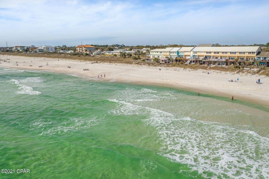Investors and second home buyers looking for an ideal Panama City Beach location only minutes from the bustling East end of 30A will be delighted with the updated interior, and forever Gulf views at this beach-front townhome near Pier Park. This three-story offering provides three levels of Gulf views, two levels of open sunning decks, and direct access to the sugar sand beaches courtesy of private access footsteps off the back porch along with a sought-after attached garage. Crisp painted cabinets, and updated interior details create an air coastal feel throughout the property, while three spacious bedrooms, and three and one-half baths ensure convenience for owners and guests is never in short supply. Adjacent to Laguna Beach, spots in the sand are plentiful, while quick access to Pier park provides countless shops and amenities, sure to please those looking for fun during their escape to the beach. Offered fully furnished, this turn key townhome offers satisfaction for those looking for the perfect property enjoy beach season, while pre-booked spring and summer guests provide passive income immediately after closing.