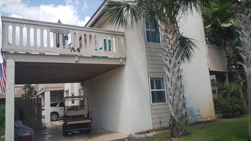 Beautiful 2 story condo. Horizon South is a family vacation spot & golf cart community with 2 pools,tennis,putt putt & community rm. Condo has laminate floors, new appliances,tile backsplash, new fixtures, new carpet upstairs in bedrooms, newly painted. Master bedroom has it's own bath with door going out to large upper deck. Great for afternoon sunsets. French doors lead from LR to a beautiful, lush backyard, with a covered porch. Sit & swing awhile or take a nature walk. If you have children or the 4 legged kind, it's a great play place. Sold furnished, except for dishes, dolls & doggie fence in backyard.