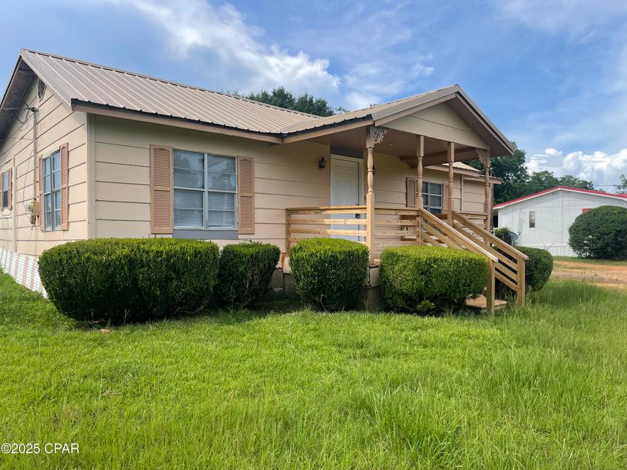 Welcome to this quaint cottage style home that sits on .70 acres. This home Is ideal for some peaceful country living and would be a great starter home. This 3-bedroom, 1-bathroom home has a small, yet cozy functional kitchen, and throughout the house you find spacious inviting rooms that have new vinyl-plank flooring, and new carpeting in the bedrooms. The atmosphere is pleasant with a very large fiving room and a very large bonus room, which both are warm and inviting for  just relaxing or entertaining guests. The spacious yard has plenty of room to enjoy outdoor activities, and if having a back-yard chicken coop, a beehive or two, is your desire, then it would be deal for the small farm hobbyist, too.  There is enough space for planting some home-grown vegetables, fruits and herbs that creates a garden that meets the table. This property is conveniently located to Hwy 231 and Hwy 273. it is just 20 minutes from Dothan, Alabama, and less than an hour to Panama City and the beautiful, white sandy beaches. It also convenient to airports, shopping, and other city amenities. The front porch can be a quiet space to sit and look west for sunsets and sip whatever you'd like! This home welcomes you with open doors into a space designed for peace and togetherness. This lovely home is full of potential — come see all it has to offer!