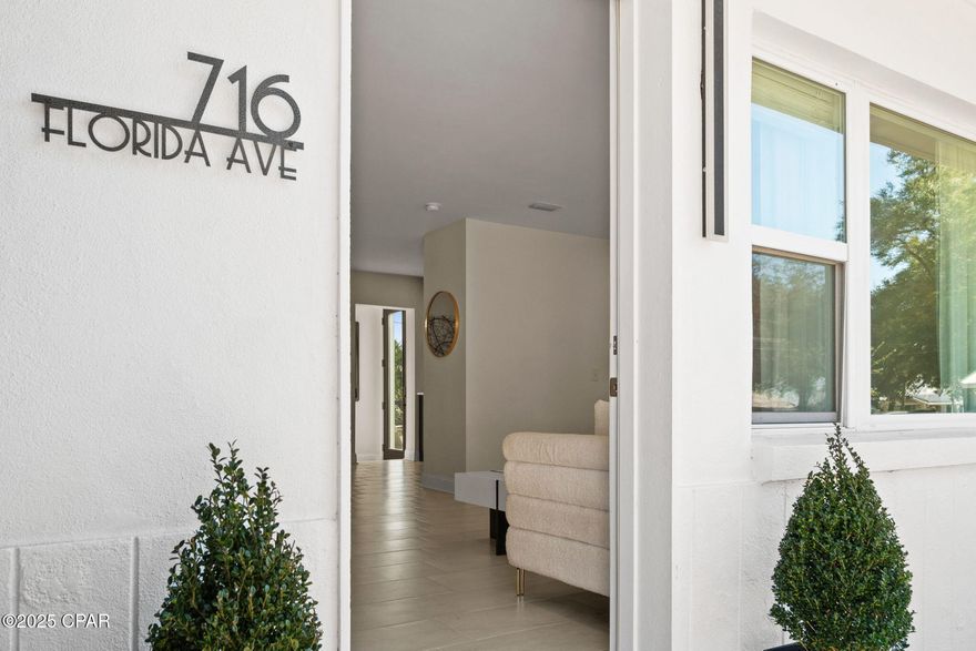 Fully Renovated & Furnished Coastal Escape with Bayou Views - Prime Central Panama City Location

Welcome to 716 Florida Avenue—your beautifully remodeled coastal retreat with scenic Johnson Bayou views, set on a spacious double corner lot and positioned in one of the most convenient, high-demand pockets of Panama City. This 4-bed, 2-bath home is move-in ready,  and minutes from the best local favorites.

Inside, an open, sun-filled living room flows directly into a stunning designer kitchen featuring navy cabinetry with gold hardware, quartz countertops, stainless steel appliances, and a statement backsplash. Three guest bedrooms and a sleek, fully updated bath—with a large walk-in tile shower—anchor one side of the home.

The opposite wing hosts a true primary retreat. Vaulted ceilings, a private balcony, and glass sliders frame peaceful bayou views, while a turquoise tile accent wall leads into a beautifully finished en suite with matching walk-in shower and double vanity. A nearby laundry room and single-car garage/workshop add everyday function.

Step outside to a spacious backyard with a 12' x 20' storage shed and an RV hookup with temporary power pole. Behind the home lies an old, unused city street that's completely full of foliage—giving the property rare privacy and the feel of a tucked-away waterfront sanctuary.

Prime Location Near Panama City's Most Loved Spots:
Can be a Short Term Rental 

½ mile to Downtown Panama City - walk or bike to restaurants, boutiques, coffee shops, live music, and festivals.

 2 miles to Historic St. Andrews - home to Oaks by the Bay Park, the marina, farmers markets, historic charm, and some of the best local dining in Bay County.

Walk Minutes to Beach Drive - enjoy scenic bayfront trails, playgrounds, fishing spots, and waterfront parks.

 5 miles to Panama City Beach Access (near St Andrews State Park)down the road to the Gulf's famous sugar-white sand.

Major Renovations & Upgrades Include:
• All new windows, doors, hardware, and tile flooring throughout
• Complete kitchen and bath remodels
• New electric service & panel
• New HVAC & ductwork in the main home + two new mini-splits in additions
• Hurricane strapping and all additions brought to hurricane code (blueprints available)
• New TPO flat roofs 
• Updated landscaping and privacy-enhancing rear green space

Beautifully renovated, and conveniently located near everything locals and visitors love especially the sunsets—this home delivers coastal charm, modern upgrades, and unbeatable proximity... a rare find with a location that truly checks every box.