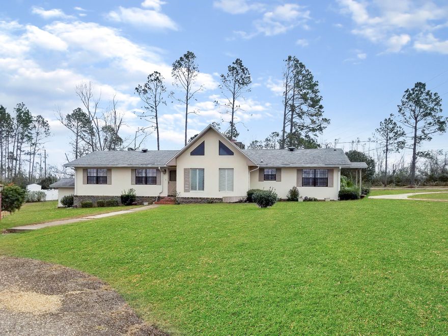 MAJOR PRICE REDUCTION! Minor hurricane damage .Very nice updated home with lake access just minutes from downtown.  Home is move in ready, it has a nice updated kitchen with new appliances,  large family room, large living room with a brick fireplace and vaulted ceilings, all the rooms have lots of natural light, there is a bonus room just off the family room, 2 nice screened porches for afternoon fun and a large patio for extra outdoor space. The a/c unit is new as well. This home is a must see.  Make your appointment today!