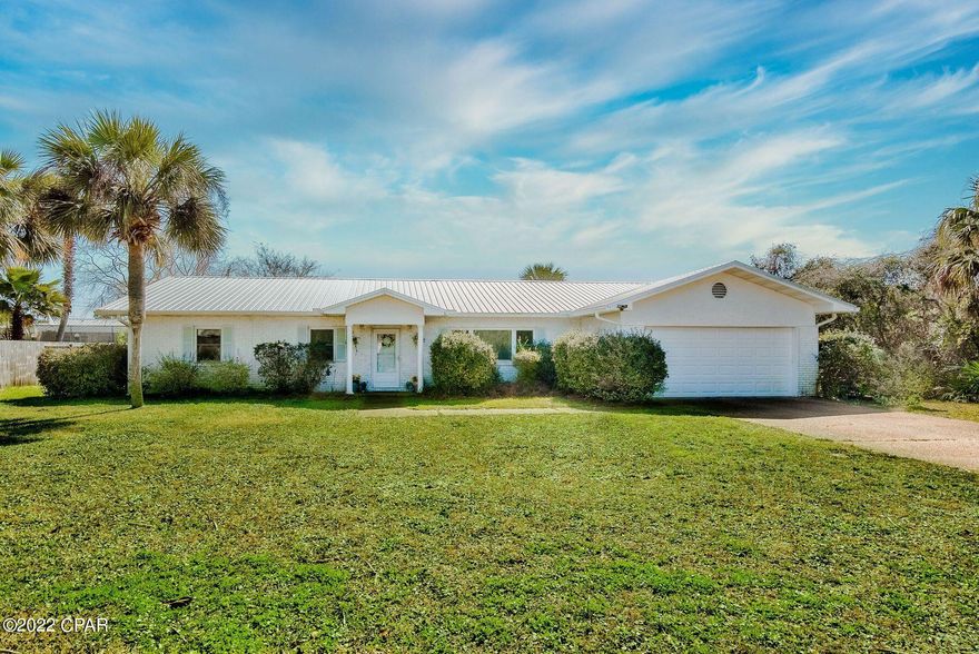 CURRENTLY UNDER CONTRACT, SELLER ACCEPTING BACKUP OFFERS. Located just one block from the sugar-white sands and crystalline waters of the Gulf of Mexico sits this beach retreat on the desirable west end of Panama City Beach. Offering more than 1,800 square feet of living space, this home boasts a large fenced backyard with a deck and hot tub. Inside, the kitchen features stainless-steel appliances and the owner's suite boasts a private ensuite bath. French doors lead to the oversized backyard, which has plenty of space for a pool. Dedicated laundry facilities and an attached two-car garage provide additional conveniences. Sells fully furnished with excellent proximity to Pier Park and Scenic Highway 30A and all of the shopping, dining and entertainment options they offer.