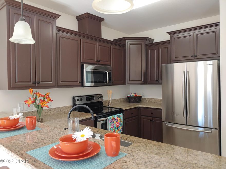 If you're Looking for low maintenance Coastal living in a Gated Community, your search stops here. Come see this Beautiful Townhome Built in 2016 with 3 bedrooms, 2.5 bath, 2 car garage in the sought after Annabella's Townhomes. Fully equipped kitchen features 42 in Cabinets, Granite counter tops, Stainless Appliances and Breakfast bar... perfect for entertaining friends and family. Open floor plan, Volume ceilings, Inside laundry room.  Community pool, fitness room, dog walking areas and low maintenance fees. Freshly Painted and Conveniently located near the sugary white sands of Panama City Beach,  shopping, schools, dining, and entertainment. A terrific value in so many ways. Put this on your list to see today!