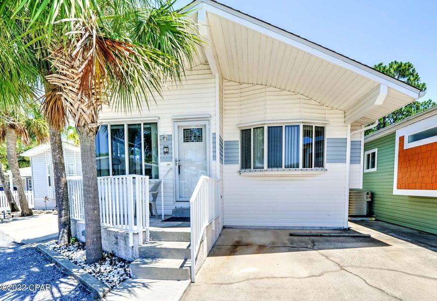 CURRENTLY UNDER CONTRACT, SELLER WILL CONSIDER BACKUP OFFERS - Rare opportunity to own this magnificent Venture Out home that backs up to St. Andrews State Park! This beautiful 3 bedroom, 2 bath has a great open floor plan and flows beautifully. The kitchen is large and open to the living room. New flooring and interior paint have recently been added. Perfect for second home or investment opportunity!  The best part of all is the stunning views of St. Andrew's State Park. Watch the deer come up while relaxing after a day on the beach. Venture Out is a golf cart community that has exploded with popularity recently. With 300' on the beautiful pristine beaches of the Gulf of Mexico and 1,000' on the Gulf!