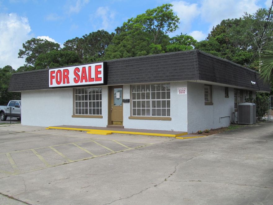 Perfect site for a service contractor or general office user.  The building includes a nice lobby and reception area with service counter, 4 offices, break room and kitchen area, restroom with shower, shop area with restroom and security system.  The site has a rear fenced yard area with Outbuilding with driveway access from Lisenby Avenue to rear of Site for additional parking and has public water and sewer. Centrally located with easy access and excellent visibility.