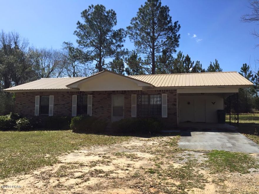 Don't miss your opportunity to own this fantastic property! This lovely 3B/2Ba brick home with covered carport has been extremely well maintained and sits on a beautiful lot with 4 full acres. New windows in 2011, new tile and laminate wood flooring in the main living areas and bathrooms in 2012, Master Bath was remodeled in 2012, new paint both inside AND outside in 2014, AC serviced and a new AC condenser motor installed in 2014, and a NEW METAL ROOF was installed in 2014. The sellers are even gifting the new buyers with a Home Warranty for extra peace of mind! Call today for your private showing. All measurements are approximate--please verify if important.