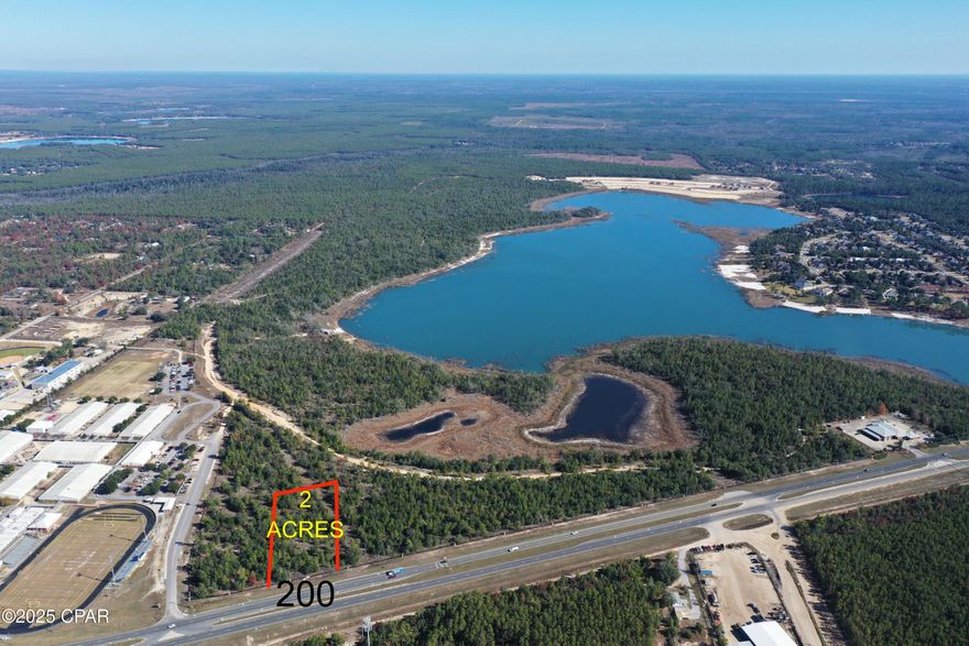 Great 2 acre, High and Dry Commercial property. Dry sandy soil, easy site to build. High traffic location next to the Lake Merial's North Entrance and the Dean Bozeman School. Additional Commercial land is available. Perfect for restaurant, office/service business, or retail store.