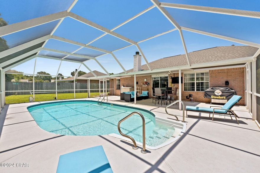 Move-In Ready Home with a SALTWATER SCREEN ENCLOSED POOL, in a highly desired school district and close to area attractions, shopping, and restaurants.  This home features a wonderful floor plan. From the time you walk through the front door you see the amount of space this home has.  It sits on a beautiful lot with .32 acres and consists of 3-bedrooms, 2-baths, and has a 2017 (50yr) roof.  One of the best features of this home is its all-wood laminate floors and tile, no carpet for easy maintenance.  The kitchen features granite countertops, all stainless-steel appliances including a side-by-side refrigerator and has a separate coffee bar with a sink.  The living room is open to the formal dining room, with direct access to the screen enclosed porch though sliders. The air conditioning was upgraded in 2016 with a top-of-the-line Lennox unit, which also controls the humidity in the home, and the seller recently added a UV light to prevent mold and disinfect equipment. The home has a programmable thermostat, faux wood blinds, ceiling fans in living room and in each bedroom, and features a wood burning fireplace.  This split bedroom floor plan has the master bedroom to the left of the home with a 11.2x5.7 walk-in closet, and a private bath with double vanity sinks, separate shower, and a soaking tub.  The other two bedrooms are to the right of the home with a full bath.  The selling point of this home is the large screen enclosed pool with plenty of decking for grills and loungers, where you can enjoy the pool bug-free with the enclosure.  The yard is completely fenced in for added privacy and features grapefruit, figs, and grapes, which were just planted 2 years ago!  There is so much more I can say about this home but it's one of those homes you need to view to appreciate.  It is priced to sell, and we do not expect it to be listed long.  Additional features include: Water Heater - 3 yrs, HVAC- 8 years, Roof - 7 years, Master Bath new sinks-2020, sprinkler on well, gutters, survey available, garage door motor replaced in 2019, Shark vacuum auto pool cleaner replaced in 2020, New Salt Cell on Pool Pump 2023 ($1500 value).   If this sounds like the home you have been waiting on, contact your favorite realtor for a private showing before your dream of owning a piece of paradise becomes someone else's realty.  Age, Sq.Ft., Taxes, Room Dimensions, Schools, or any important information to the buyer must be verified by a personal or professional inspection.