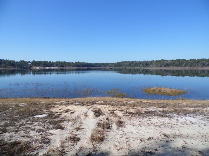 This cleared fenced lot Is the perfect spot to build your dream home. No restrictions on beautiful Spring Lake. The garden spot has sprinklers ready for your spring crop! New well and septic make this complete!! There is a small barn and 'shop' with electricity.