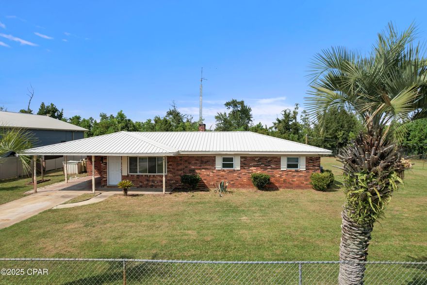 CURRENTLY UNDER CONTRACT, SELLER WILL CONSIDER BACKUP OFFERS Welcome to 2531 E 40th Plaza, this all brick ranch home has so much potential to unlock for a owner occupied fixer upper or a solid fix and flip. Boasting 2,126 sq ft , this 3 bedroom 2 bath home features a metal roof that was installed in 2019, a newer HVAC, a renovated master bath with tile shower, a new kitchen and all new vinyl insulated double pain windows, all installed in 2019.  The home is situated on just over half an acre in the heart of town, minutes to Lynn Haven, 23rd street corridor or several grocery stores.  With plenty of room to spread out, room to build a shed, pole barn or have a Rv storage facility.  The property is completely fenced with a 6 ft. chain link on three sides and a vinyl privacy fence on the fourth side which allows for plenty of parking and also has a newer 12X20 triple door shed which is anchored and placed on a custom concrete slab.  Don't miss out on a great opportunity to make this your home. Please verify all sizes and information.
