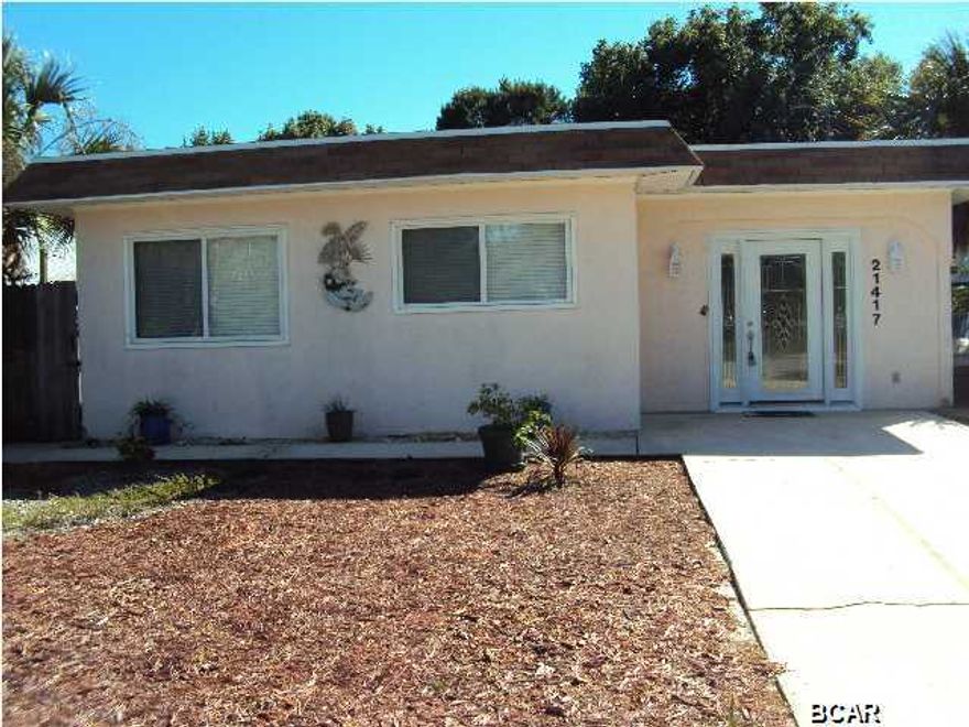 TOTALLY RENOVATED INTERIOR. This house is a must see. Located only .4 mile from the beach, with updated kitchen and baths, spacious guest rooms and master bedroom, large closets in every room and with a very private screened porch across the back of the home. Enter through an enclosed entry with a rustic brick floor and built in bookshelves. Tile floors through the entire home are ideal for beach living. The updated kitchen has beautiful granite countertops, a breakfast bar, GE Profile SS gas range with electric oven, Milano free standing hood, GE Advantium Microwave/oven and hickory cabinets, some with glass fronts for displaying your favorite pottery. Natural gas has been run to the property for hot water heater, gas grill and range. Outside you will find a large storage building for your beach toys and yard equipment. The roof was replaced in 2009, the central air system August 2014 and new gas water heater March 2015. You will love the convenience of this location. Publix, Winn-Dixie, CVS, Carousel Grocery and Thomas' Donuts all within a 2 mile radius. Drive a little farther east and you with be at Pier Park with shopping, restaurants and entertainment. A short drive to the west will take you to 30A with more restaurants and activities. Don't miss this great property.