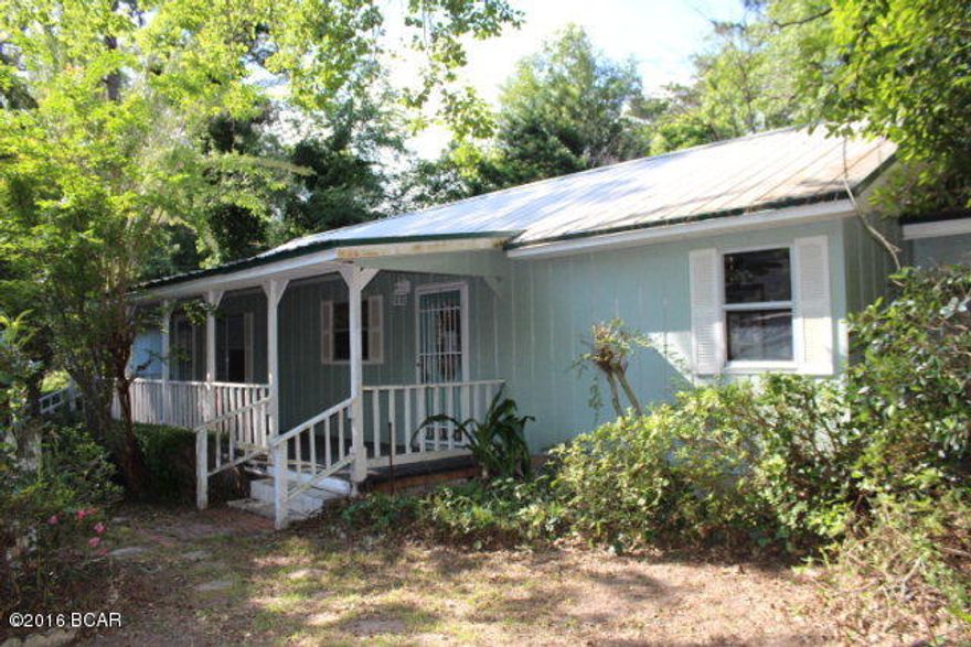 PRICE REDUCED!! Cottage style home that sits up on a hill on almost an acre lot. Several out buildings that were previously used apparently in a plant business. The home is a typical 40's style that is cute as a buttom with a front porch all the way across it. It has a large living room, large master bedroom with master bath and an adjoining room that would be perfect for an office or a sitting room. A great place for person with hobbies as the out buildings can be utilized for many various purposes.