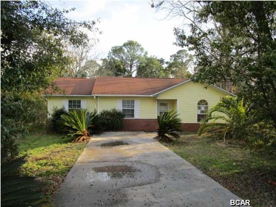 CENTRALLY LOCATED home in the heart of Panama City! This home features a kitchen with a breakfast bar that is open to the living and dining areas, and a Master bedroom that has an adjoining sitting/office area. The Master bath with a double vanity has a shower/tub combination, and the second full bath is conveniently located near the two additional bedrooms. Off the kitchen/dining area is a screened porch.