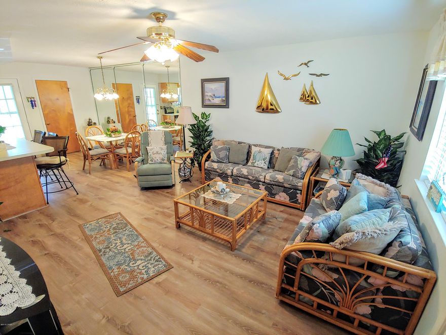 **Backs up to Putt Putt Course**  This is a very nice 2 Bedroom Townhouse with 1.5 Baths located in the Gated Resort. If you are looking for a PERFECT RENTAL in a Resort that is WALKING Distance to the BEACH... Here it is! The HOA Dues are only $450 a Quarter NOT a Month and that pays for your  Basic Cable Package, Termite Bond, Household Trash, some Pest Control, Mowing your Lawn, and Lots of Amenities. Speaking of Amenities, there are 11 Pools ''5 Heated'', Shuffleboard Courts, Tennis Courts ''2 Lighted'', an 18 hole Mini Golf Course, Conference Center, Fitness Room PLUS there is a Private Clubhouse with a Snackbar and a Pool directly on the Beach and its also ''Gated''!!! There is NO Extra Charge to use the amenities.  Age, SF, and Dimensions are approximate... please verify if importan