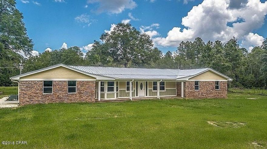 Beautifully renovated home on TEN ACRES in a perfect location.  Spacious brick home sits back from paved Highway 20 with plenty of room to roam, have a garden, or animals.  Kitchen has a 40'' granite bar with custom-made cabinets and pull-out drawers.  New stove, dishwasher and range hood.  Gorgeous bay window in dining room.  Living room has vaulted ceilings and a wood-burning fireplace.  Real bamboo hardwood flooring in all common areas and new carpet in all bedrooms. Other renovations include blown-in Icynene Foam Insulation, new metal roof, new windows and sheetrock. Also has a new HVAC that is still under warranty.  Attached 1-Car Garage with a concrete patio. Also has a nice concrete patio behind home.