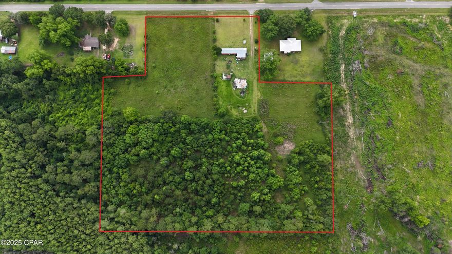 Country Living with Creek, Wildlife & Fenced Acreage in Graceville!

Discover the charm and potential of this 8.5-acre property located in the heart of Graceville, FL. This 3-bedroom, 2-bathroom mobile home is a fixer-upper, offering a great opportunity for customization, investment, or your very own country homestead.

Approximately 3.5 acres on the right side of the property are fully fenced—ideal for cows, horses, or other livestock. A smaller fenced-in area along the road frontage adds flexibility for additional animals or hobby farming. Toward the back, a small creek winds through the land, attracting deer and other wildlife—perfect for nature lovers.

A new well was installed less than 2 years ago, providing peace of mind and a great start to future improvements. The property is conveniently located just minutes from local restaurants and grocery stores, and only 65 miles from Panama City Beach—offering the perfect blend of rural living with access to modern amenities.

Don't miss this opportunity to create your own country retreat. Schedule a showing today!