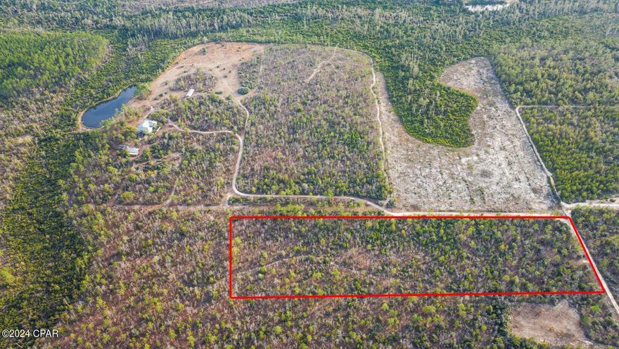 Discover the perfect space for your aspirations! This expansive 10-acre parcel in Calhoun County, FL awaits your vision. Positioned just passed the Bay County line lies an elevated and dry area with a level terrain, this land presents a pristine canvas, offering excellent possibilities for a future home site or hunting retreat. The lightly wooded landscape features a small driveway and path, providing convenient access to the property. Revel in the best of both worlds, as this parcel is also just 50 minutes away from the renowned World's Most Beautiful Beaches of PCB. Enjoy the privacy of this secluded location, but still just over 2 miles to Hwy 231 and a Dollar General. Note that there is no current survey, and boundaries are approximate and should be confirmed by the buyer. So much potential with this remarkable piece of land!