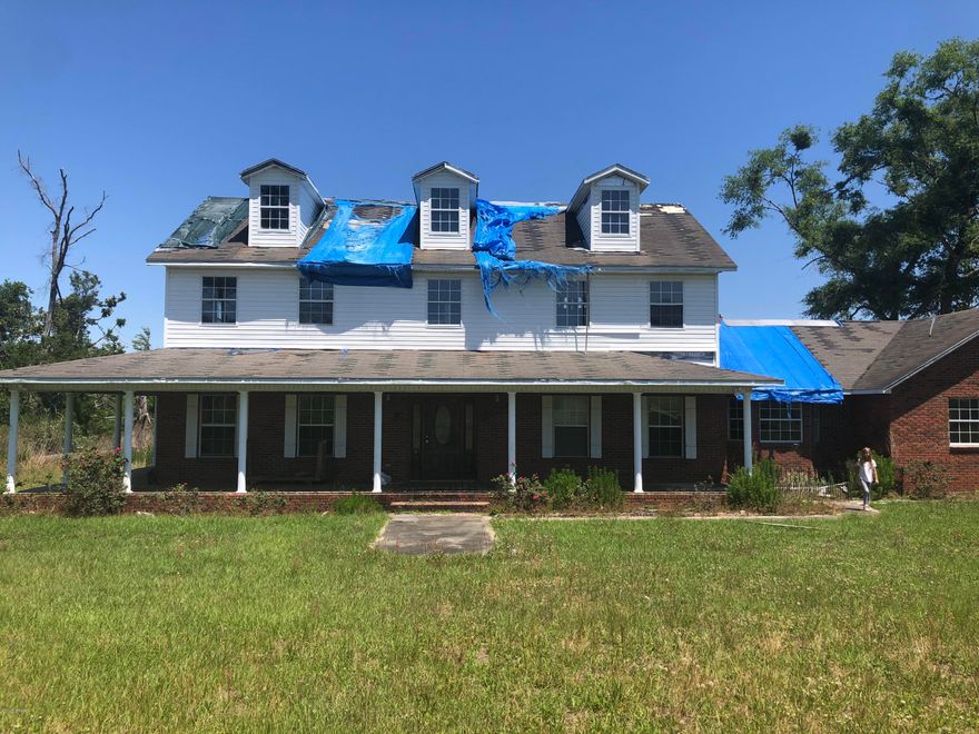 Stunning home on 20 acres with severe hurricane damage. Stables and in ground pool make this the perfect opportunity to have your dream home! Both parcel IDS 23-2N-10-0000-0015-0104 and 24-2N-10-0000-0001-0000 convey.