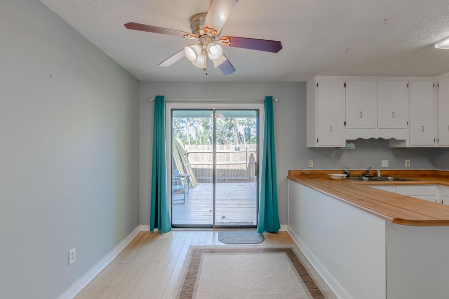 CURRENTLY UNDER CONTRACT, SELLER ACCEPTING BACKUP OFFERS. You will fall in love with this well maintained 2 bedroom townhome that is close to Tyndall Airforce Base and a short drive to the world's most beautiful beaches!  This is a wonderful small community that does not have any HOA fees. The upstairs features a master bedroom with a private balcony, Jack-and-Jill bathroom, and the 2nd bedroom. The 2nd floor is all wood flooring with the exception of the full bath which is tiled.  The hot water heater was replaced in 2018, and the roof was replaced in December of 2018. This home is not located in a flood zone so you are not required to carry flood insurance. You have a relaxing back porch that is fully fenced in for entertaining and grilling your favorite dinner! There is also an outside closet and a closet under the stairs in the living room for added storage. This property is a must see and won't last long!