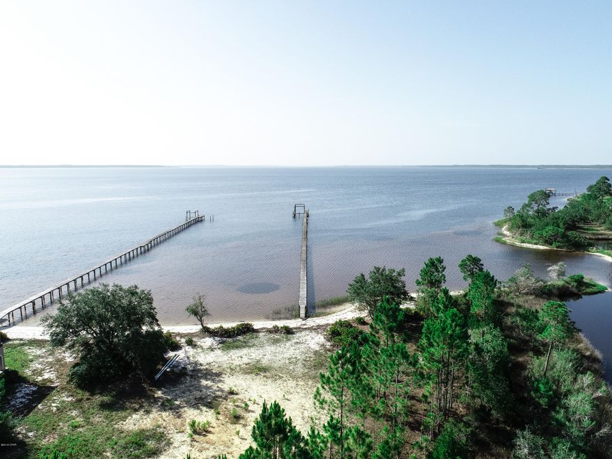 This is the lot that you are looking for. Seclusion, incredible water views,sunsets that will leave you speechless, Lot 1 boasts a dock, 150 +/- ft. of bay, and then another 200 + ft of canal on one side. Water everywhere. Property is on city water and sewer, property offers direct access to the intercoastal waterway, and the gulf of Mexico. This is one of a kind, you want the best views, some acreage, water frontage, and seclusion. You better come see it your self.