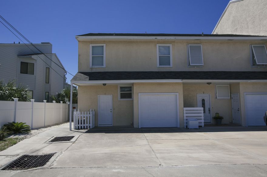 Beach front living on quiet west end of beach, yet close to Pier Park shopping & dining.  Endless possibilities for makeover to a home of your dreams and taste.  A rare end unit, fee simple townhouse with no association fees. Units like this on the west end of the beach are hard to find.