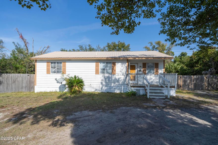 Spacious lot with ample room to enjoy outdoor living. This well-maintained 3-bedroom, 2-bath home features a custom-built back deck and a durable metal roof. Inside, you'll find a generously sized kitchen with abundant countertop space, along with comfortable living and dining areas ideal for everyday living or entertaining.

The home includes washer and dryer hookups for added convenience. A privacy fence surrounds the backyard, providing a secure and quiet space to relax, entertain, or store recreational vehicles such as boats and RVs.

This property is an excellent opportunity for first-time buyers, those looking to downsize, or investors seeking a reliable rental.