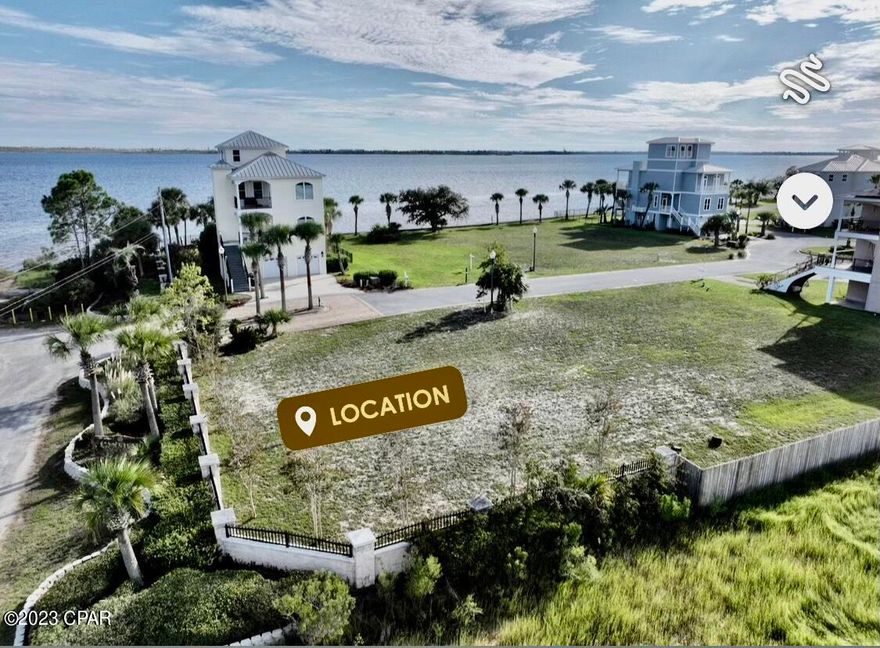 Beautiful vacant lot with deeded boat slip on the East Bay. With quick boating access to the intercoastal Saint Andrew Bay and Gulf of Mexico, this is a boater's dream. Come build your custom home in this upscale gated community near Tyndall.