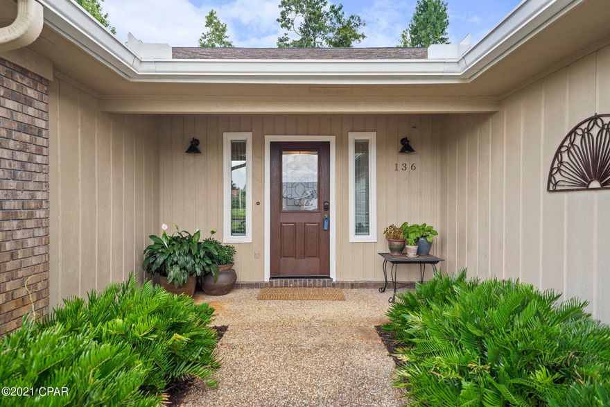 'CURRENTLY UNDER CONTRACT, SELLER ACCEPTING BACKUP OFFERS Come see this beautifully remodeled home in Derby Woods. This location is conveniently located close to schools, shopping and Tyndall AFB. This home will not require lender implemented Flood insurance and is close to parks and walking trails. As you enter into the foyer, you we notice the large vaulted living room featuring new vinyl plank flooring throughout, a white washed wood burning brick fireplace that was recently serviced. Fresh paint, new blinds, new double glass sliding doors with many options for furniture placement. The spacious kitchen boasts a fresh color pallet, new quartz countertops, new backsplash, and stainless-steel appliances and room for a floating island. Off the kitchen you will find a large pantr and an office cubby. The bedrooms are all spacious rooms with lush new carpets fitted with ceiling fans, the master en-suite that includes a fabulous walk-in glass/tile shower, a double quartz vanity, a practice linen closet and a luxurious walk-in closet with a built-in shelving system. The expertly landscaped backyard is truly an oasis to enjoy, with a large vaulted covered patio that can be enjoyed all year long right off the living space.  The back yard also has room for a pool or other yard activities; perfect for grilling and hosting events . Other Features: oversized climate-controlled garage with a sealed floor and wash room, new windows, recessed lighting, new roof, new garage door and motor and so much more.