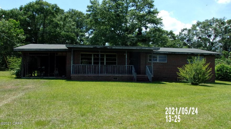 Finish Renovations and Save with this 3 bedroom 1.5 Brick home on 1 acre.  Renovations are about a third complete. Some ceilings have to be completed. Bathrooms have to be completely finished. Hardwood floors in most if house just needs revitalization. Hardwood walls in living room and dining room.  All spacious rooms. Inside laundry room. No heat and air unit. Some appliances are located inside house but not  sure they work.  1 car carport. Attached Storage buIlding. Good sized shed. Located short distance to town on paved county road. Finish and resale with a good profit in todays market!!!!