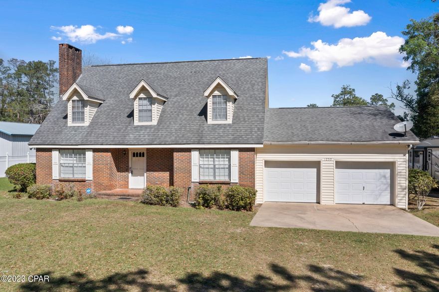 This brick beauty is situated on a spacious lot in downtown Chipley and is within walking distance to shopping, restaurants and Shivers Park.   With a little updating, you can easily customize this to be your dream home.  Amazing features of this home include large bedrooms with plenty of closet space, a wood burning fireplace, a separate formal dining room, plenty of storage space, a security system, a large 2 car attached garage and a very nice yard with a pear and fig tree.  This home has also been zoned to allow for commercial use if desired.   This property is located only about an hour from the World's Most Beautiful Beaches.   Contact your favorite realtor for a showing today!!!