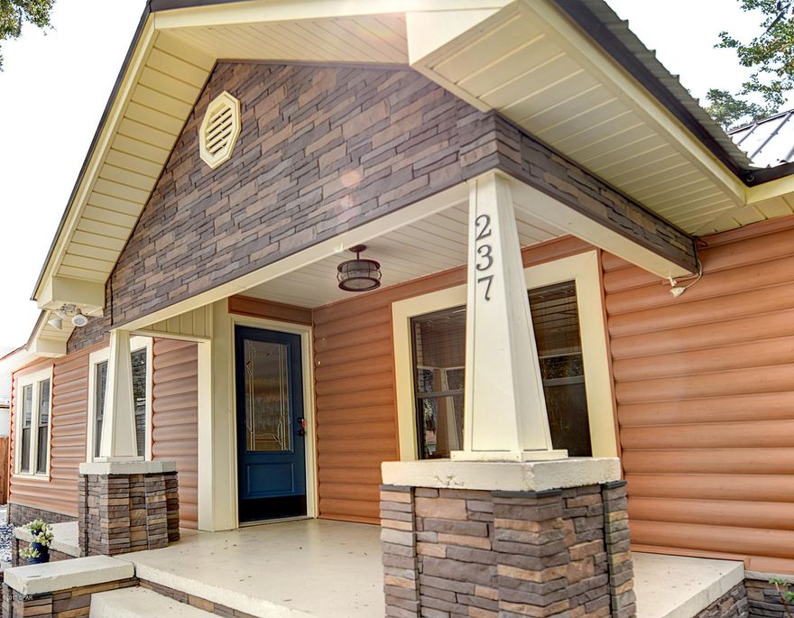 You are going to fall in love with this adorable fully renovated home the minute you step in the front door, or better yet, when you pull in the front drive and realize ''Oh my, here's a log cabin right in the middle of downtown Millville!''  Enter the great room to this comfortable & relaxing home with recessed lighting river rock feature wall, gorgeous white washed distressed look Pergo floors that flow throughout the home except for the newly carpeted bedrooms and tile bathrooms.  Kitchen has been updated with new cabinetry, nice appliances  include a smooth top stove and built in double ovens and Corian countertops.  Dining area has built in cabinet and countertop to match the kitchen for more storage.  Three bedrooms and two full baths that have been completely redone with tile and stone floors, updated vanities, nice fixtures, and tub/shower combo in each.  You won't believe your eyes when you step into the backyard, for all the fun entertaining and relaxing areas!  You can also drive into the back under the fully covered carport areas and conrete driveways that will literally hold up to 7-8 cars if you wanted to.  Huge wood deck areas that surround the above ground pool that is very nice.  The backyard is very private with high privacy fencing.  Tons of deck space and an outdoor shower.  This still leaves room for a big open green space in the backyard along with a storage building to put your gardening tools, etc.  New metal roof was put on in 2014.  Carport and pool were also put in during that year.  This home is truly a must see.  You can walk or bike to the waterfront park 3-4 blocks away or take a stroll over to Sweet Magnolia's for lunch two blocks from your home! Check out the 3D floor plan, virtual tour, video and aerial tour and full picture gallery and then make your appointment to start planning your move!  (Side note for those that want to know -  the original solid pine floors are underneath all the new flooring.)