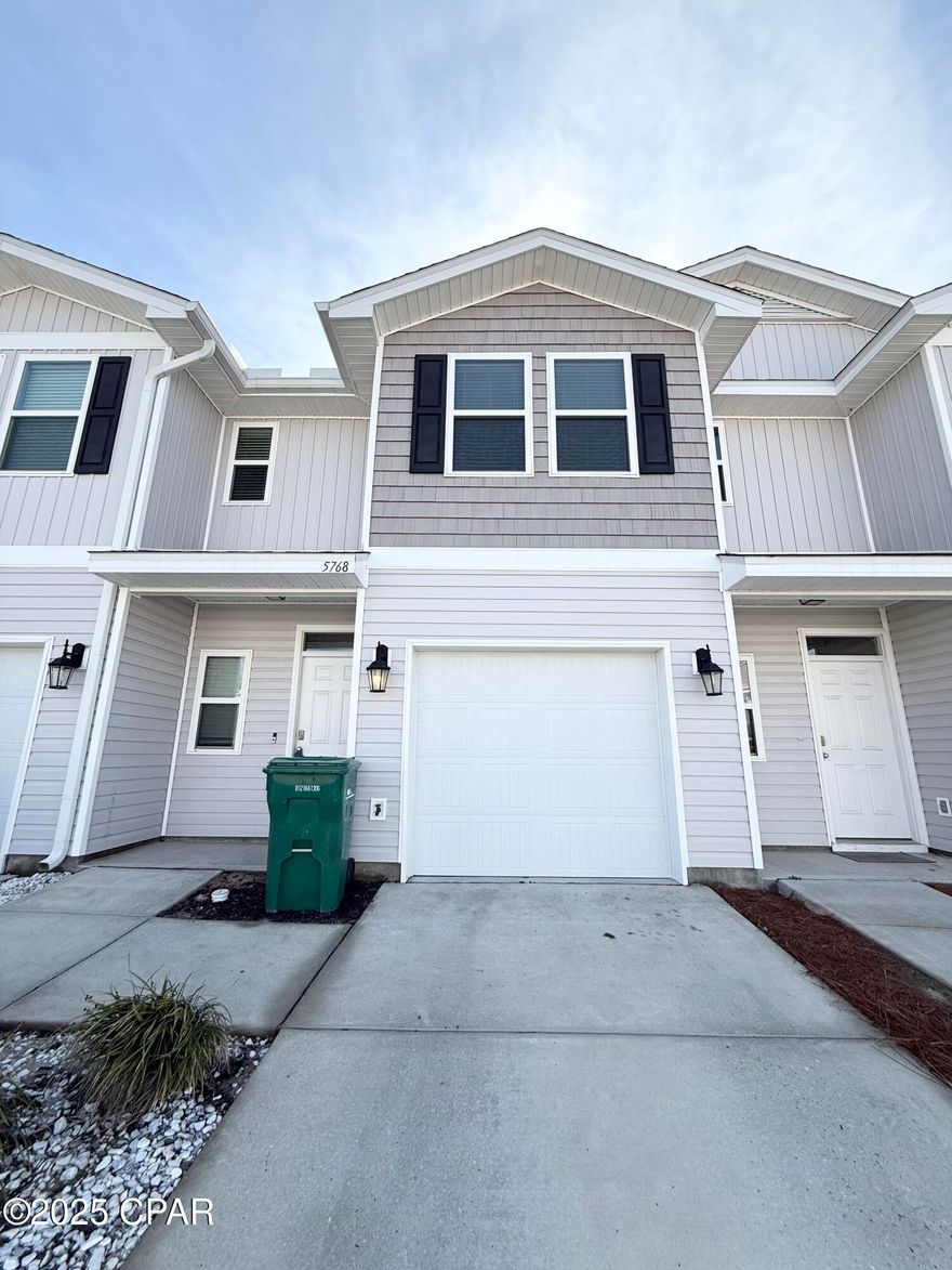 Charming 2-story townhome in Sentinel Point, featuring 3 bedrooms, 2.5 bathrooms, and a serene pond view. This home offers a single car garage, durable vinyl flooring in common areas, and cozy carpeting in the upstairs hallway, stairs, and bedrooms. The open-concept kitchen flows into the living and dining areas, complete with a breakfast bar for casual dining. Sentinel Point boasts fantastic amenities, including a community pool, sidewalks, and ample guest parking. Conveniently located just minutes from Tyndall Air Force Base, shopping, and a variety of dining options