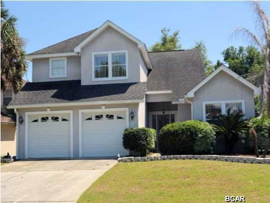 Country Club living at its ''best'' and a major price reduction to boot!!!!! Here is an excellent opportunity to live and play in the prestigious Panama Country Club. Play golf everyday for the rest of your life as you live in this outstanding golf course home overlooking the famous seventh green. This beautiful home features a spacious eat-in kitchen, formal dining area and a large living room with fireplace. From the screen enclosed patio and the side and back courtyards, you'll watch your friends tee it up on the 7th as they try to clear this hole's very challenging water hazard. The master bedroom with private bath is situated on the ground floor. There is also a powder room just off the utility room. Plenty of room for friends and family as three large bedrooms and a bathroom ar