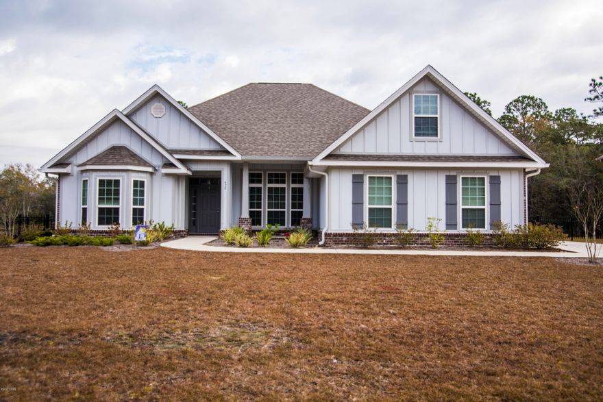 Better than new home on a large lot! Beautiful 4 Beds/2 baths, plus an office. The home offers an open floor plan, split bedrooms, large kitchen w/granite counter tops, abundance of cabinets for storage, nice size pantry, formal dining room, and large master suite with immaculate bathroom. The additional three bedrooms are spacious and offer ample closet space. You'll enjoy the privacy of the gigantic fenced back yard overlooking the woods. No neighbors in your back yard! The screened in Florida room enhances the beauty of the private yard. Don't forget to bring your bathing suites because this community has a resort style pool, recreation area, and park to hold your family gatherings! Located just minutes to Lynn Haven, airport, 22 min. to Tyndall and Bea