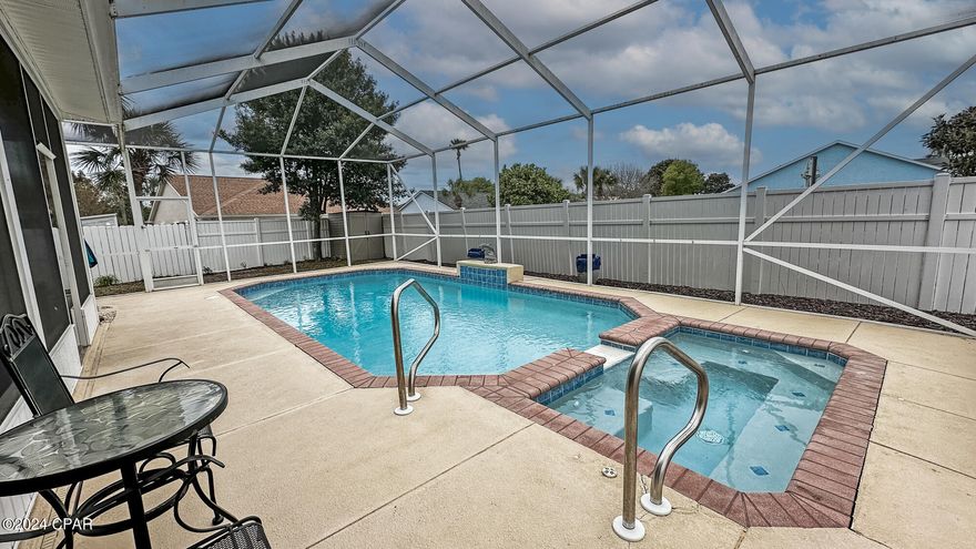 MOTIVATED SELLER! Beautiful 3 bedroom 2 bath home with a 2 car garage in the highly sought after Summerwood neighborhood on the South side of Panama City Beach Parkway. Golf cart friendly neighborhood and located less than 1/2 mile to Pier Park, Restaurants, Shopping and walking distance to the beach. This home offers a new roof, new flooring in living and dining room, 10 foot ceilings, screened porch, large pool and jacuzzi with screened lanai with fenced back yard. The pool was also just resurfaced. Call for a private showing today!