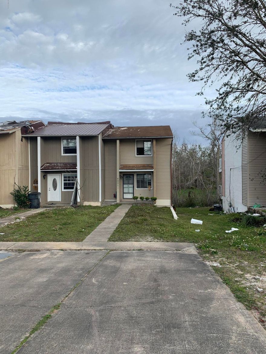 This is a wonderful investment opportunity on Lake Martin. This 2 bedroom 1.5 bath end unit has a gorgeous water view and is close to Tyndall Air Force Base. The home sustained major roof damage during the hurricane and will need to be gutted. Property being sold As-Is.