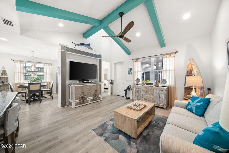 Fins Up! Dive into the ''no worries'' lifestyle with this stunning Camellia cottage in the highly sought-after Phase 4A of Latitude Margaritaville Watersound. Walking distance to the town center, dog park and the retail; this home is packed with upgrades, making it the perfect retreat for those ready to live on ''island time.''       
Home Highlights:  
Chef's Island Kitchen: Features an extended kitchen island with Level 1 Luna Pearl granite , custom Level 3 white tile backsplash , and sleek 42'' Grey Hound cabinetry with crown molding.
   Upgraded Living Spaces: Bright and airy with LED recessed lighting throughout the main living areas and a convenient pocket door added to the Master Bath for a streamlined flow.   
  Stylish Master Suite: Relax in a master bath featuring Level 3 Calacatta Empire floor tile and elegant granite countertops.     
Thoughtful Additions:  
Laundry Room: Custom cabinets added to the ceiling for maximum storage.   
Garage: Professional epoxy flooring for a clean, durable finish, plus a utility sink and full insulation package plus garage door insulation!
     From the whole-house gutters to the stainless steel preferred appliance package, every detail has been handled. Just bring your flip-flops and start living the dream!     INCLUDED with the purchase of this home is the refrigerator in the garage, the commercial ice maker in the garage, the ice chest in the garage and the great room TV with Bose Sound Bar.  All other furnishings are for sale.  See the documents section for items not for sale and full list of upgrades!