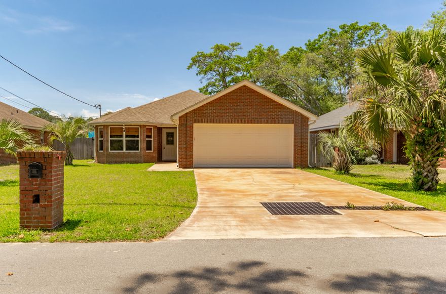 Don't pass this one by, it's a winner all around. Shockingly nice all brick,  one-owner 3 bedroom, 2 bath home was built in 2010 and is practically new! Has brand new flooring throughout, vinyl plank in the kitchen, hallway and baths and brand new carpeting in the living room and bedrooms. Large living room features an oversized bay window which gives the interior and exterior a nice architectural feature, not to mention the natural light that it gives this house. Maple cabinets (including a pantry) in the kitchen offer abundant storage and all the countertops are granite in the kitchen and baths. Nice sized bedrooms, the master bedroom features 2 walk in closets and a huge double sink vanity in the master bathroom. The screened porch overlooks the freshly sodded privacy fenced back yard, with easy maintenance thanks to the automated sprinkler system and irrigation meter! There's even a double gate in the back, if you need it. 2 car attached garage. Convenient location! Only 2 blocks to the Lynn Haven Marina, Leslie Porter Park and about 4 blocks to the newly renovated Sheffield Park - walk to the summer concert series at the new Lynn Haven Ampitheater!! 100% financing - this home is in a USDA eligible area! Make an appointment to see this one today! It's not going to wait!!! (All sizes approximate and taken from public records buyer to verify any details buyer deems important)