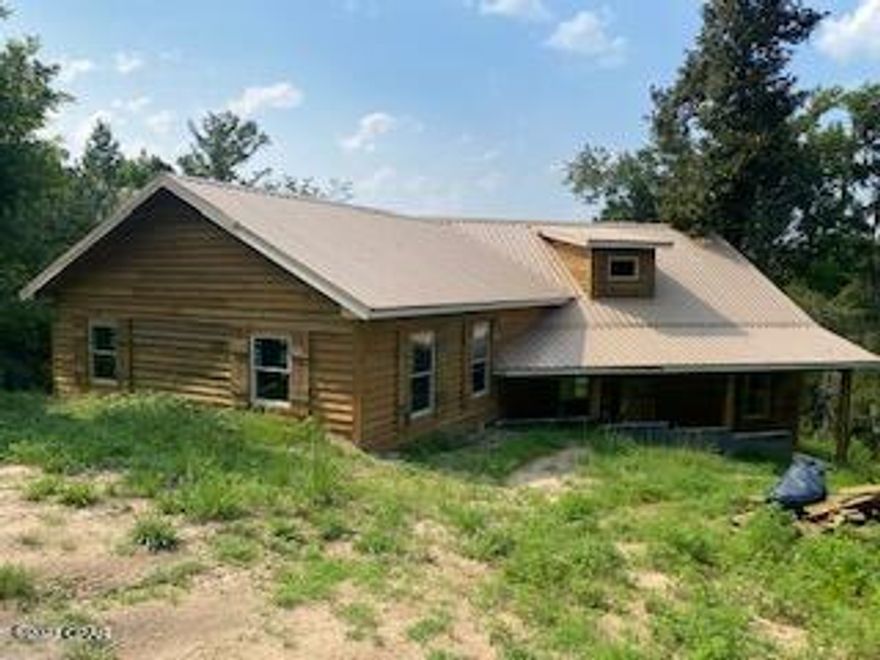 This is a unique opportunity to purchase a custom built home, but finish it the way you want it to be done! The construction on the home was started in 2018, but has been on stand still for various reasons. It is about 60% finished. This home is on Merritt's Mill Pond with an amazing view from the high bluff it sits on. The home is a 3 bedroom, 2 1/2 bathroom home with an open living and kitchen floor plan with vaulted ceilings and fireplace.  The home features a large back porch that overlooks the Mill Pond and the master bedroom has picture window views. There is already a nice dock built onto the pond and a separate pole barn. Merritts Mill Pond is a unique 202 acre pond fed by blue springs. It is a paradise for swimming, boating, fishing, and cave diving. The lot has over 100' of waterfrontage. The home is located in Indian Springs, a desirable neighborhood in the Marianna area. This home deserves to be lived in and finished to its full potential! An air conditioner has already been purchased, but is not installed in the home yet.