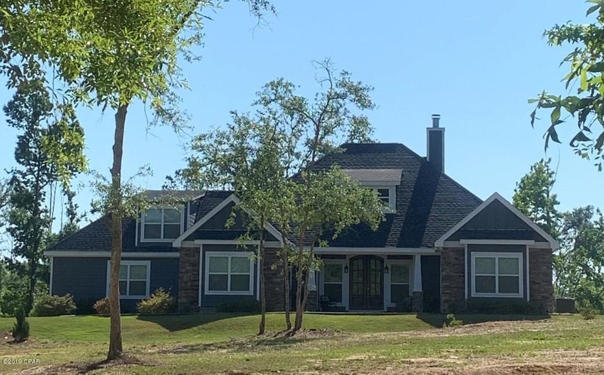 Beautiful custom built 4 bedroom, 3 bath home with bonus room upstairs.  This very immaculate, well maintained home was recently built in 2015 and is still in new condition!  Built with hurricane straps and engineered trusses able to sustain category 5 hurricane winds.  There was no damage to the home from hurricane Micheal.  Sits on almost 5 acres and is conveniently located on the west side of Marianna, FL. only 68 miles from the emerald beaches of N. Florida and only 36 miles from Dothan, Alabama.  Split floor plan with stacked stone fireplace, hardwood floors through out, carpet in bedrooms, tile in bathrooms.  Custom kitchen cabinets, with large island and eating area with stainless steel appliances and granite counter tops.  Wall to wall tile walk-in shower in master bath. Private, quiet neighborhood with wonderful neighbors.