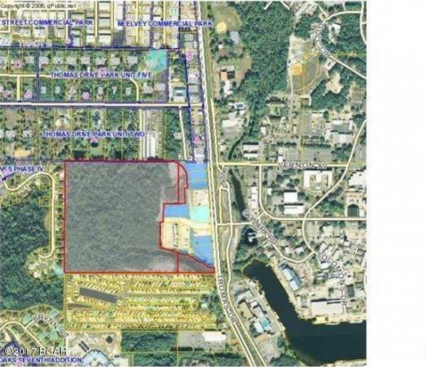 BANK FORECLOSURE OPPORTUNITY: 40.4 Acre of land in an incredible location with a multitude of possibilities. Approved density is R-5 (multi-family 15 units per acre) with a maximum height of 10 stories along with Approximately 8 acres of C-3 commercial zoning of. High traffic area. Class A Retail fronts most of this property with several national chains anchoring it. LaQunita, UPS, SAKE Sushi House, and many other major restaurants and retailers provide an additional value add to this property. Click on additional pictures for architectural appeal and layout of front retail development. Close proximity to Bay Point, Preserve, St. Andrews State Park, Nationally recognized golf courses (Jack Nicklaus design course) Nationally recognized restaurants (Captain Andersons), and the worlds most beautiful beaches. Directly across Thomas Drive is the Naval Surface Warfare Center Panama City Division which employs in excess of 2,000 civilian and military personnel WITH $117 MILLION IN DIRECT PAYROLL. All information estimated and should be verified by seller if important. Boundary survey, topography, recent proposed engineering and marketing and information package available upon request.