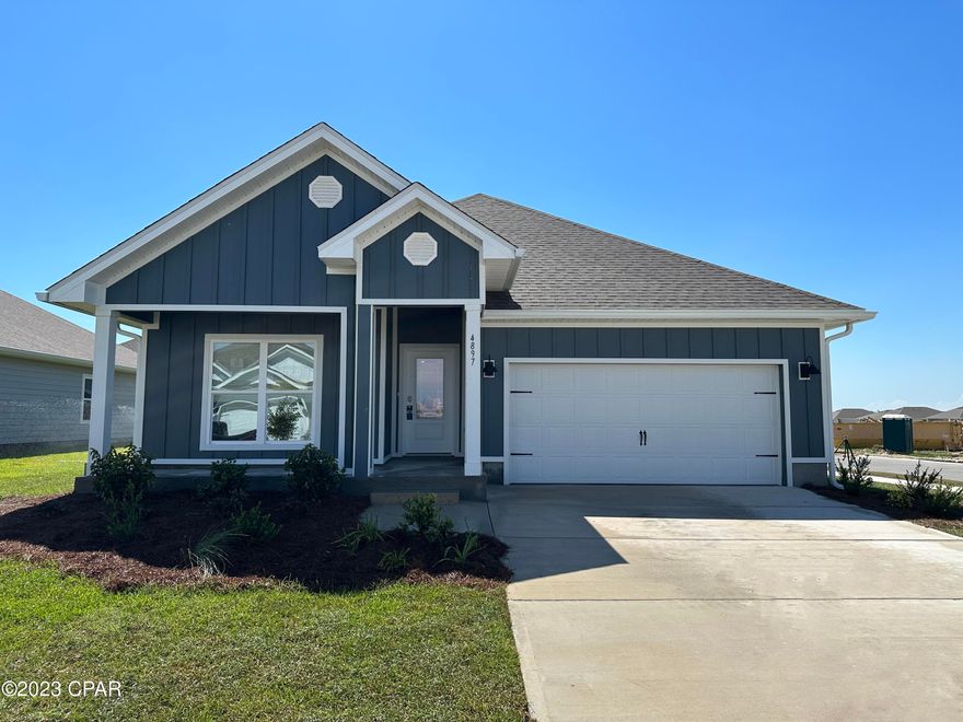 Bayside at Ward Creek is at the heart of Panama City Beach, accessible by sidewalk to Pier Park, Frank Brown Park, and the Conservation Park with the Gulf of Mexico less than 3 miles away. | The Rhett floorplan is a one-story, four-bedroom, two-bathroom home with over 1,700 square feet of living space. All three guest bedrooms are locate in front of the home. The kitchen is towards the center of the home that features white cabinets and granite counter tops with large center island that opens up to the dining area and living room. The primary bedroom is split from the three  guest bedrooms. The primary bathroom has a standing shower as well as a full soaker tub, double vanity sinks, and a large walk-in closet.