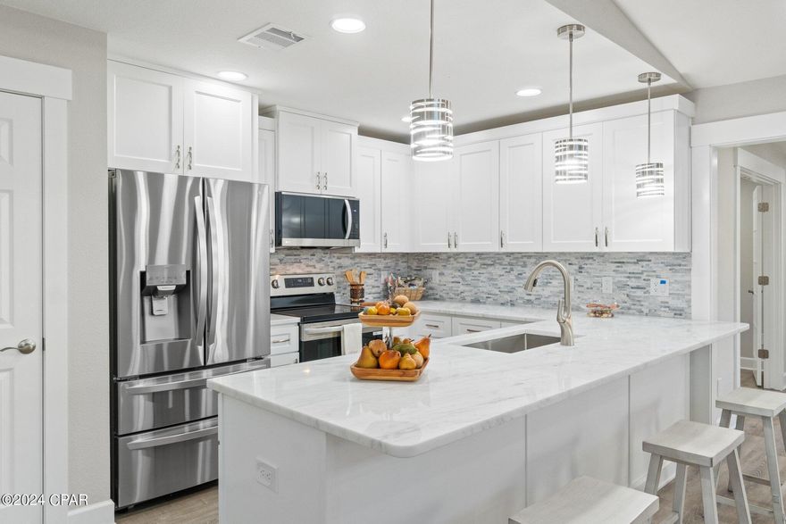 Welcome to your completely updated home where modern convenience meets the warmth of family living. Upon entering the front door, you're greeted by an open floor plan perfect for entertaining or cozy family gatherings. The kitchen boasts new stainless-steel appliances, new cabinets with new quartz countertops with ample counter space, and a breakfast bar, making it the heart of the home. The bathrooms feature new vanities, flooring and fixtures. New contemporary luxury vinyl planks throughout make this home so warm and inviting This stunning property offers a good size yard with privacy fencing all around it. This home is centrally located to just about everything in town. Beautiful landscaping and a workshop in the backyard. Buyer to verify all pertinent information.