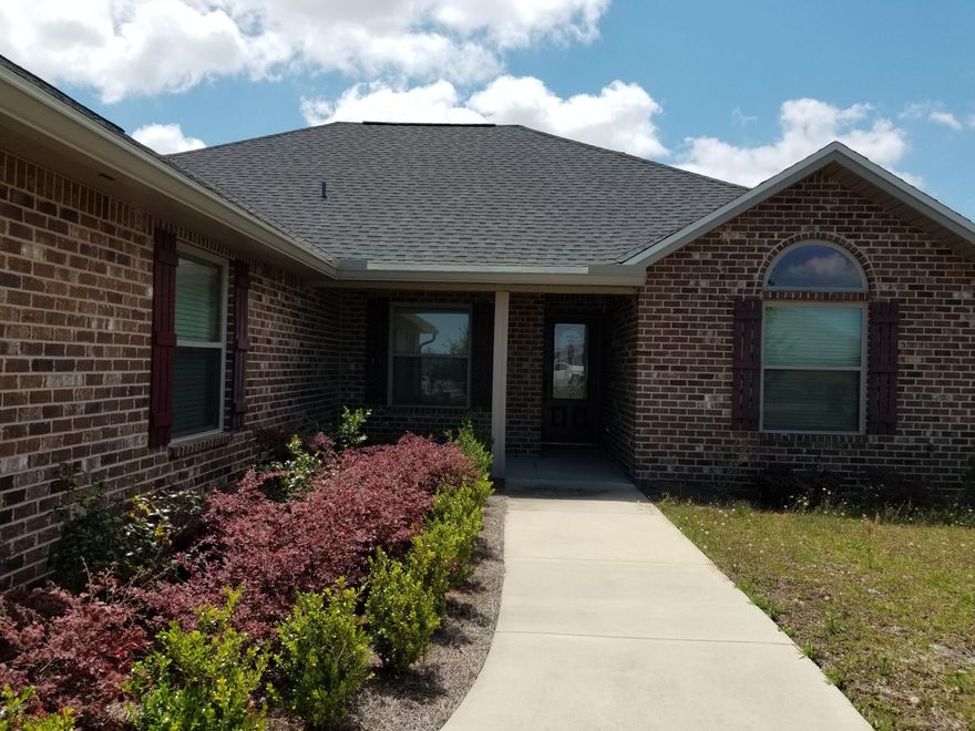 Open House Today 10am - 2pm on this Split 3 bedroom 2 bath all brick home with front porch that offers master bath with his & hers double shower with Rain maker (3 shower heads) and shower seats on both ends and large walk in closet with accessory closet. The kitchen has real wood cabinets, solid surface countertops and stainless steel appliances and drinking water filter system. There are cabinets in the laundry room including a washer & dryer. Living room has electric fire place and crown molding. Home comes with a security system and generator ready electrical outlet & generator. Outdoors screen porch and open porch with outside shower. Man cave located in two car garage and two many other upgrades to mention. This house was built to the 140 MPH wind code. Call for a private tour today.