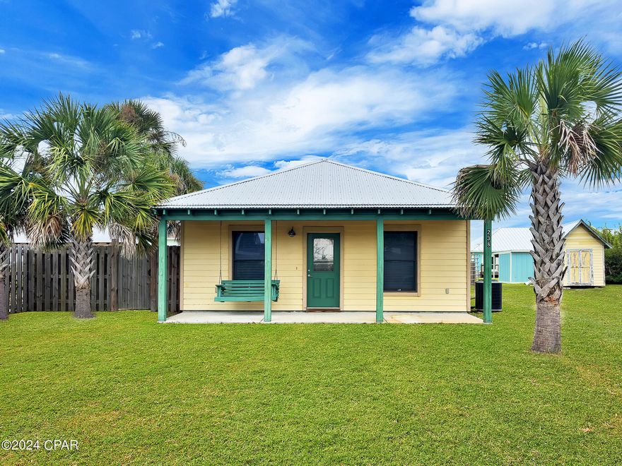 Welcome to your slice of paradise in beautiful Mexico Beach! This delightful 2-bedroom, 1-bathroom home is situated on an almost quarter-acre lot, offering the perfect blend of comfort and convenience. Featuring an open concept living, dining, and kitchen area with tile floors throughout, this home is both stylish and easy to maintain. Both bedrooms are generously sized and share a well-appointed bathroom with a tub/shower combo. The covered front porch, complete with a cozy swing, invites you to relax and enjoy the coastal breezes. The large yard provides ample space for outdoor activities or gardening. Located conveniently close to the beaches, as well as local shops and restaurants, this property is perfectly positioned to enjoy all that Mexico Beach has to offer. Whether you're looking for a primary residence, a beach getaway, or a lucrative long-term rental opportunity, this charming home is ready to welcome you. Don't miss out on this coastal gem!