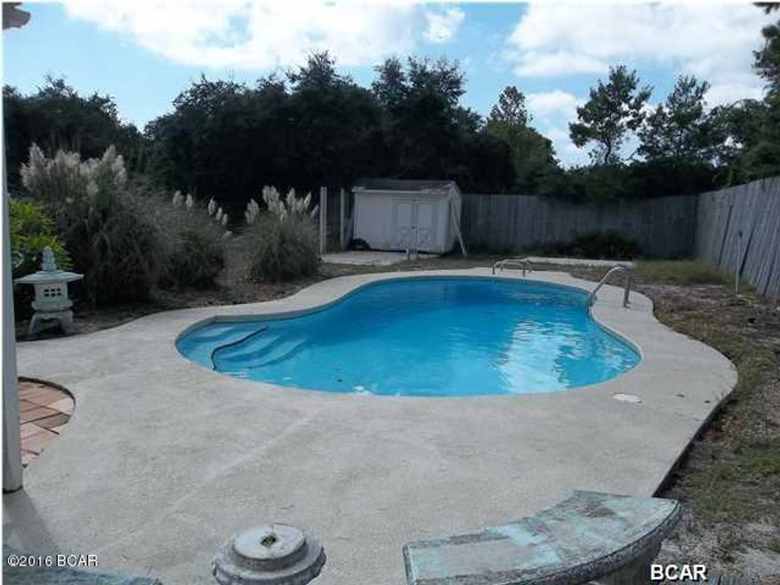 MOTIVATED SELLER!!!! On a large lot south of Hwy 98 and is walking distance to the beach with a very nice kidney shaped GUNITE POOL!  The roof was recently resealed with Elastomeric, stucco pressure washed, wood trim painted.  Beach home or rental income property.  Lot zoned R2 and large enough to add a guest cottage. Lovely tiled walk in shower with double shower heads in main bath with skylight plus a water closet in the bonus room that is perfect for a family room or a place for the kids to hang out on a rainy day.  Full time or part time this home will give you memories to last a lifetime. 6 Months of professional pool service by Cox Pool is inclued.
