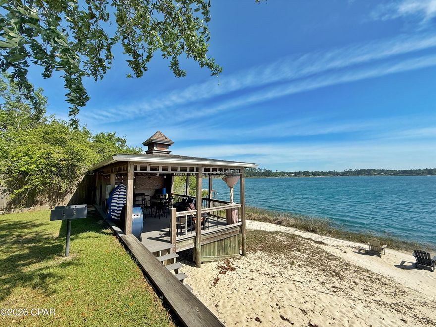 Experience the perfect blend of privacy, comfort, and lakeside living with this exceptional waterfront lot on Silver Lake. Fully fenced and gated with an automatic entry, this property offers a rare opportunity to enjoy a serene, secure retreat surrounded by natural beauty.

The lot is fully equipped with a well, septic system, and 220-amp electric service, making it move-in ready for weekend getaways or extended stays. A covered RV setup includes a 2018 RV that conveys with the property, along with a separate carport for additional parking or storage.

Two versatile sheds--both with electricity and window A/C units--expand your living and utility space. One shed is fully outfitted with a washer and dryer hookup, complete with units, while the second includes a convenient bathroom with sink and toilet, perfectly positioned for easy access from the lake.

At the water's edge, you'll find everything you need to enjoy this pristine, spring-fed lake. Relax on the covered Trex deck with ceiling fan, ideal for shaded afternoons and lakeside grilling. A stunning white sand beach leads to your private dock, complete with a super slide and rope swing for endless fun on the water.

Silver Lake's electric-motor-only policy helps preserve its peaceful atmosphere and crystal-clear waters, making this an ideal destination for those seeking tranquility without sacrificing recreation.

Whether you're looking for a private escape, a family retreat, or a unique investment, this one-of-a-kind waterfront property delivers it all.