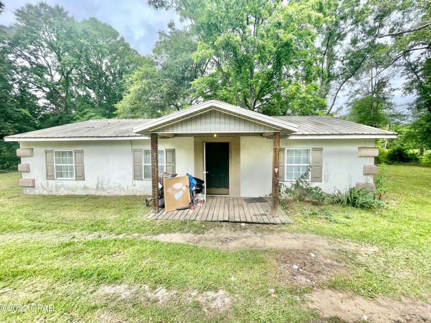 CURRENTLY UNDER CONTRACT, SELLER WILL CONSIDER BACKUP OFFERS! Four bedroom home in the city limits on a slab with a metal roof. The home was renovated in 2014 so the kitchen, bathrooms, and main components of the home were updated within the last 10 years. The yard is spacious and surrounded by woods on three sides. The home needs some TLC. With four bedrooms it would be great as a rental investment property or something you can buy cheaper and make it cute! Cash or conventional loans only.