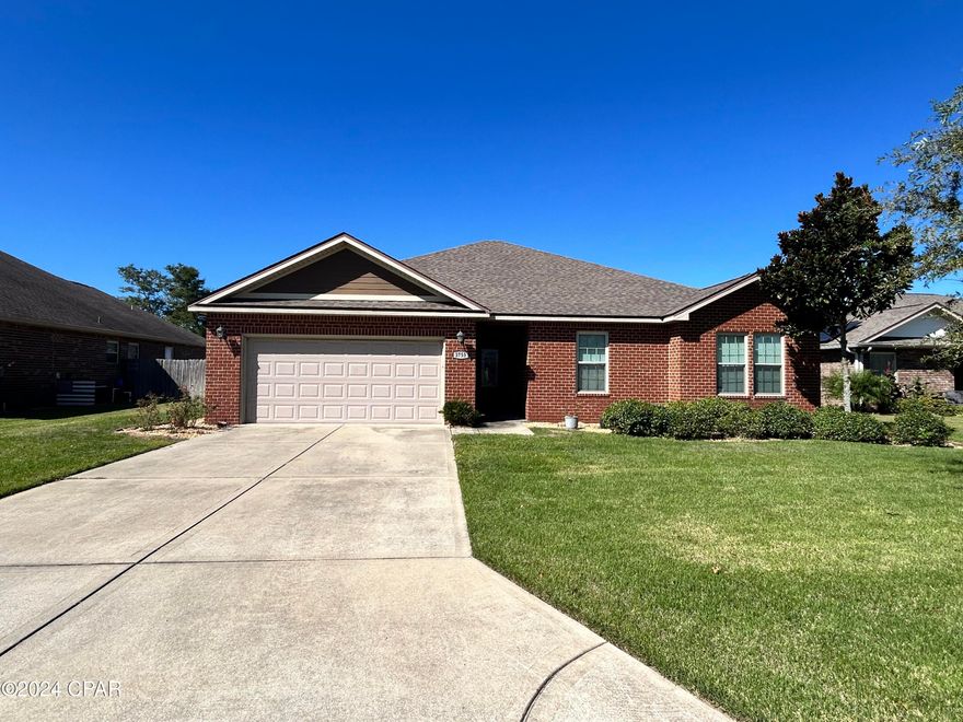 This beautiful 4 bedroom, 2 bathroom brick home located in Panama City, FL. This spacious house features tile flooring in the kitchen, wood LVP in the living room, and cozy carpet in the bedrooms. The kitchen boasts an island for extra counter space and the master bedroom includes a walk-in shower and separate soaker tub for relaxation. With a laundry room for convenience and a two-car garage for parking, this home has everything you need. Step outside to enjoy the inground pool, perfect for cooling off on hot summer days. Don't miss out on the opportunity to make this house your home.